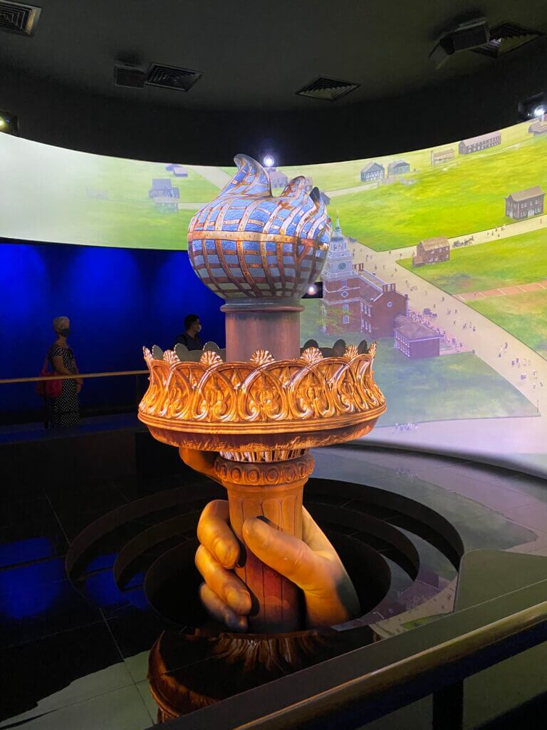 Liberty's torch with the LED screen backdrop telling the story of USA values